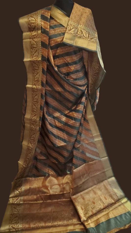 Traditional saree with intricate patterns draped over a chair
